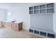 Mudroom with built-in storage cabinets, sink, and bench seating, perfect for organization at 5753 Brendlynn Dr, Suwanee, GA 30024