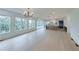 Expansive open concept with kitchen, dining, and living area with scenic views at 5753 Brendlynn Dr, Suwanee, GA 30024
