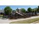 Community playground with a slide, climbing structures, and a safe play area, perfect for children at 5753 Brendlynn Dr, Suwanee, GA 30024