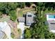 Stunning aerial view of an estate home with a pool, lush landscaping and mature trees at 225 Blueberry Rdg, Milton, GA 30075