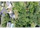 Aerial view of property with pool, deck and sprawling green yard; surrounded by a beautiful wooded area at 225 Blueberry Rdg, Milton, GA 30075