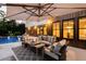 Relaxing outdoor patio with comfortable seating, an umbrella, and a view of the pool at 225 Blueberry Rdg, Milton, GA 30075