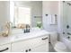 A clean bathroom featuring a white vanity, a modern mirror, and a walk-in shower, providing a refreshing space at 225 Blueberry Rdg, Milton, GA 30075