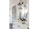 Modern bathroom featuring a double vanity with decorative lighting and modern fixtures and a large mirror at 225 Blueberry Rdg, Milton, GA 30075