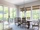 Charming dining room with large windows and sliding glass doors leading to an outdoor space at 225 Blueberry Rdg, Milton, GA 30075