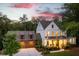 Beautiful two-story modern farmhouse with a welcoming front porch and attached two-car garage at 225 Blueberry Rdg, Milton, GA 30075