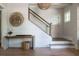 Inviting foyer with a staircase, shiplap wall, and decorative accents at 225 Blueberry Rdg, Milton, GA 30075