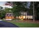 Charming two-story home with a manicured lawn and inviting front porch, perfect for relaxation and enjoyment at 225 Blueberry Rdg, Milton, GA 30075
