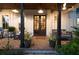 Welcoming front porch featuring a swing, classic rocking chairs, and brick paving at 225 Blueberry Rdg, Milton, GA 30075