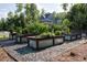 A home garden with tiered planter boxes filled with lush greenery and vegetable plants at 225 Blueberry Rdg, Milton, GA 30075