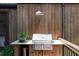 Close-up of the grill area, featuring a stainless steel grill with the wooden facade at 225 Blueberry Rdg, Milton, GA 30075