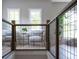 Stylish upstairs hallway features seating, natural light, and modern railing, creating a welcoming transition space at 225 Blueberry Rdg, Milton, GA 30075