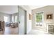 Stylish hallway with a sliding door, seating, and natural light, creating a bright and functional transition area at 225 Blueberry Rdg, Milton, GA 30075