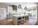 Bright kitchen with a spacious island, custom range hood, and open layout at 225 Blueberry Rdg, Milton, GA 30075