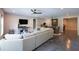Open concept living area featuring concrete floors, neutral walls, and ceiling fan at 225 Blueberry Rdg, Milton, GA 30075
