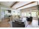 Open-concept living room with hardwood floors and large windows offering ample natural light at 225 Blueberry Rdg, Milton, GA 30075