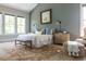Spacious main bedroom features a large bed, accent rug, and plenty of natural light from multiple windows at 225 Blueberry Rdg, Milton, GA 30075