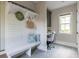 Cozy mudroom with built-in bench, storage, and decorative patterned flooring at 225 Blueberry Rdg, Milton, GA 30075