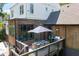 Aerial view of the patio showcasing outdoor seating, dining area, and the home's exterior at 225 Blueberry Rdg, Milton, GA 30075