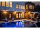 This is a beautiful backyard pool with seating and lighting for a great summer vibe at 225 Blueberry Rdg, Milton, GA 30075