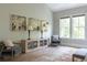 Cozy bedroom sitting area with chairs, accent table, and large windows with a view to the outside at 225 Blueberry Rdg, Milton, GA 30075