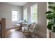 Cozy sitting area with natural light and hardwood floors, creating an inviting space for relaxation and reading at 225 Blueberry Rdg, Milton, GA 30075