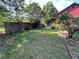 Backyard featuring landscaping, grass, fence and trees at 2539 Dogwood Hills Ct, Austell, GA 30106