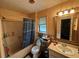 Well-lit bathroom with vanity, toilet, and tub-shower combo at 2539 Dogwood Hills Ct, Austell, GA 30106