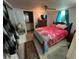Comfortable bedroom with a bright window, a ceiling fan, and tile flooring at 2539 Dogwood Hills Ct, Austell, GA 30106