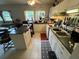 A well-lit kitchen featuring white cabinets, tile flooring, and an island at 2539 Dogwood Hills Ct, Austell, GA 30106