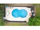 Aerial view of an in-ground pool with a slide and surrounding deck at 320 Williamsburg Cir, Mcdonough, GA 30253