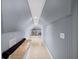 Finished attic space with beadboard, overhead lighting, and tile flooring at 320 Williamsburg Cir, Mcdonough, GA 30253