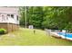 Spacious backyard with an in-ground pool surrounded by mature trees at 320 Williamsburg Cir, Mcdonough, GA 30253