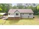 Backyard with a chain-link fence, white deck, and lush green lawn at 320 Williamsburg Cir, Mcdonough, GA 30253