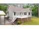 View of the backyard with a white fenced deck and steps to the yard at 320 Williamsburg Cir, Mcdonough, GA 30253