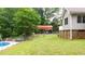 Backyard showing the pool, yard, fence, and carport at 320 Williamsburg Cir, Mcdonough, GA 30253
