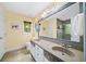Bathroom featuring double sinks, granite countertops, and an oversized mirror at 320 Williamsburg Cir, Mcdonough, GA 30253