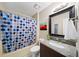 Bathroom featuring a shower-tub combo with polka dot curtain and granite topped vanity at 320 Williamsburg Cir, Mcdonough, GA 30253