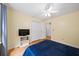 Bedroom with hardwood floors, ceiling fan, and closet, creating a comfortable space at 320 Williamsburg Cir, Mcdonough, GA 30253