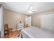 Bedroom with hardwood floors, ceiling fan, and closet, creating a comfortable space at 320 Williamsburg Cir, Mcdonough, GA 30253