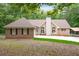 Attractive single-story brick home with black shutters and a lush green lawn at 320 Williamsburg Cir, Mcdonough, GA 30253