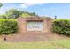 Community entrance sign with a brick base and manicured landscaping at 320 Williamsburg Cir, Mcdonough, GA 30253