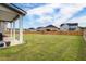Expansive backyard with a well-maintained lawn, enclosed by a wooden fence for privacy at 3236 Papyrus Palm Rd, Loganville, GA 30052