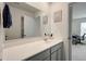 Well-lit bathroom features a large mirror and vanity with quartz countertops at 3236 Papyrus Palm Rd, Loganville, GA 30052