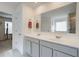 Bright bathroom features double sinks, ample counter space, and a large mirror at 3236 Papyrus Palm Rd, Loganville, GA 30052