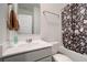 Bathroom with tub and shower combination featuring updated vanity and neutral paint at 3236 Papyrus Palm Rd, Loganville, GA 30052