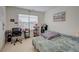 Comfortable bedroom with natural light, a desk for study, and cozy bed for relaxing at 3236 Papyrus Palm Rd, Loganville, GA 30052