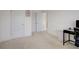 Neutral bedroom with white doors and trim, offering a clean and versatile space at 3236 Papyrus Palm Rd, Loganville, GA 30052