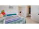 Inviting bedroom with bright walls, soft bedspread, and attached bathroom access at 3236 Papyrus Palm Rd, Loganville, GA 30052