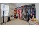 Organized walk-in closet with ample hanging space and shelving for all your storage needs at 3236 Papyrus Palm Rd, Loganville, GA 30052